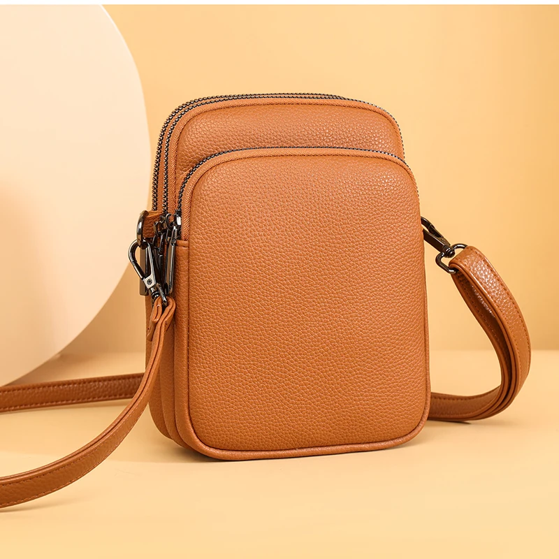 Bolso cruzado de piel de vaca 100% auténtica para mujer, bandolera de diseñador para teléfono móvil, novedad