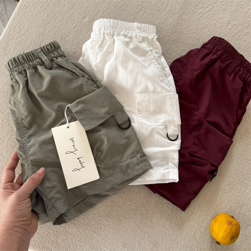 Children's shorts 2025 summer new boys and girls solid color pocket shorts baby versatile five-point pants tide