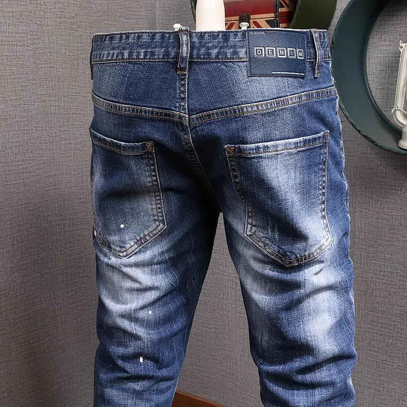 Moda urbana hombres Jeans Retro lavado azul estiramiento Slim Fit pintado rasgado Jeans hombres Vintage diseñador Denim pantalones Hombre