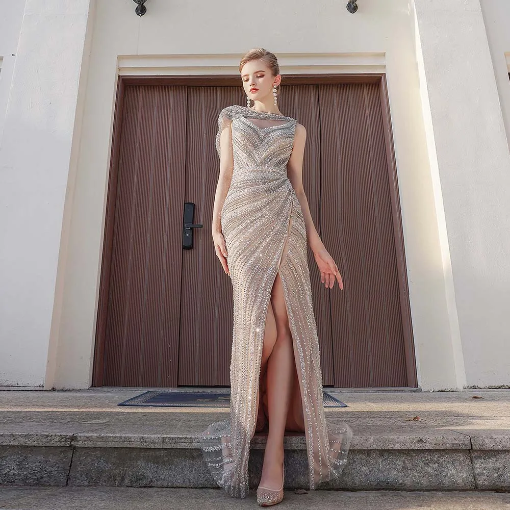 Vestidos de Noche árabes de lujo con diamantes de imitación de Dubái, sirena con capa, tul con cuentas, abertura, desfile, boda, fiesta de graduación, hechos a medida