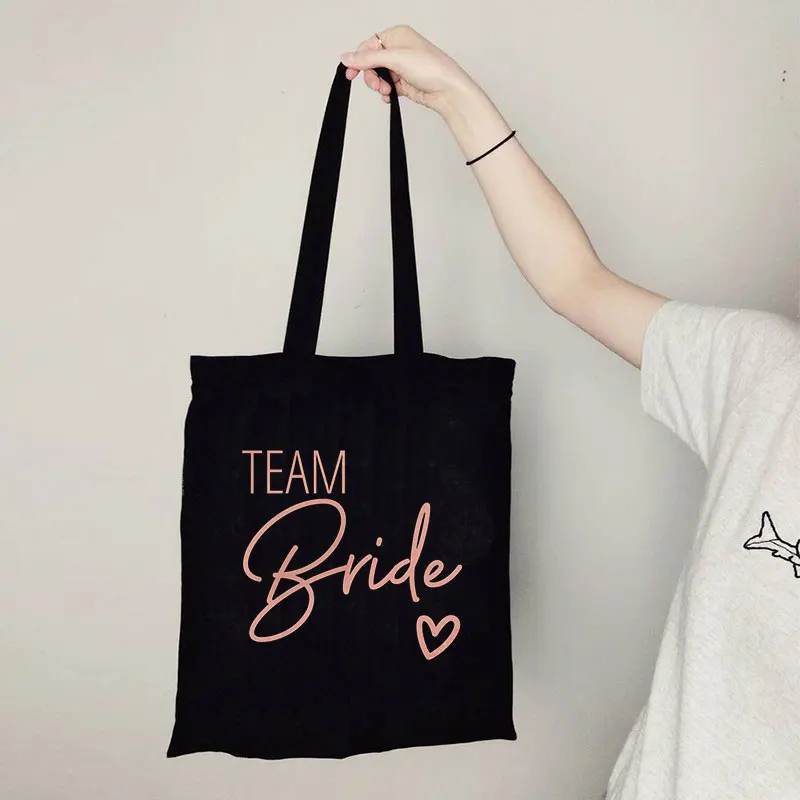 Team Bride-Bolso de mano grande e informal para mujer, bolsa de compras de lona con estampado de fuentes Rosas y blancas, de alta calidad, lavable