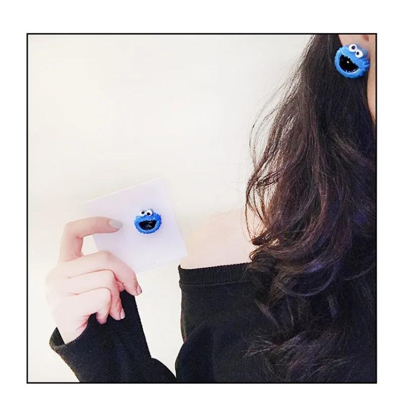 Barrio Sésamo Elmo Cookie Monster anime periférico muñeca de dibujos animados estilo pendientes para niños y niñas accesorios de alto valor regalos