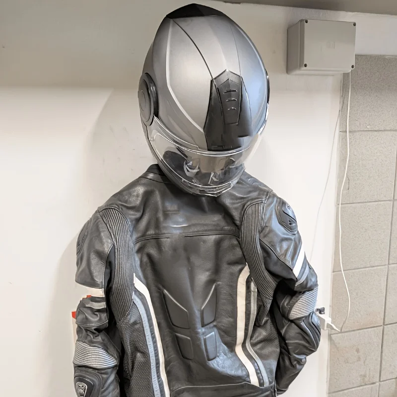 Motorcycle helmet on double ring wall holder