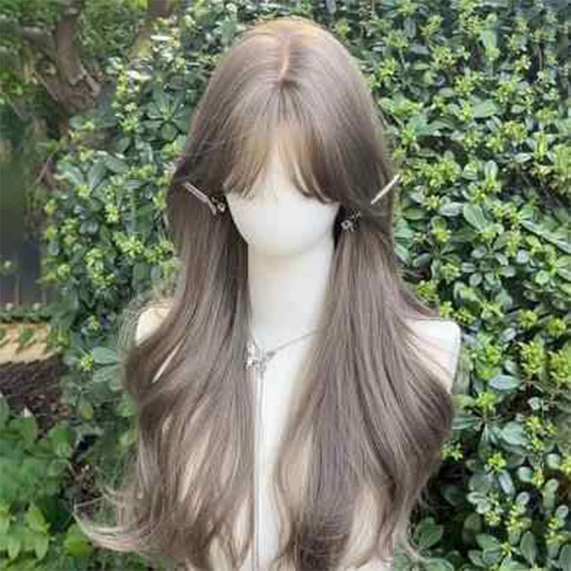 

A wig for a woman with long curly hair in a bluish-brown color, straight bangs and large waves