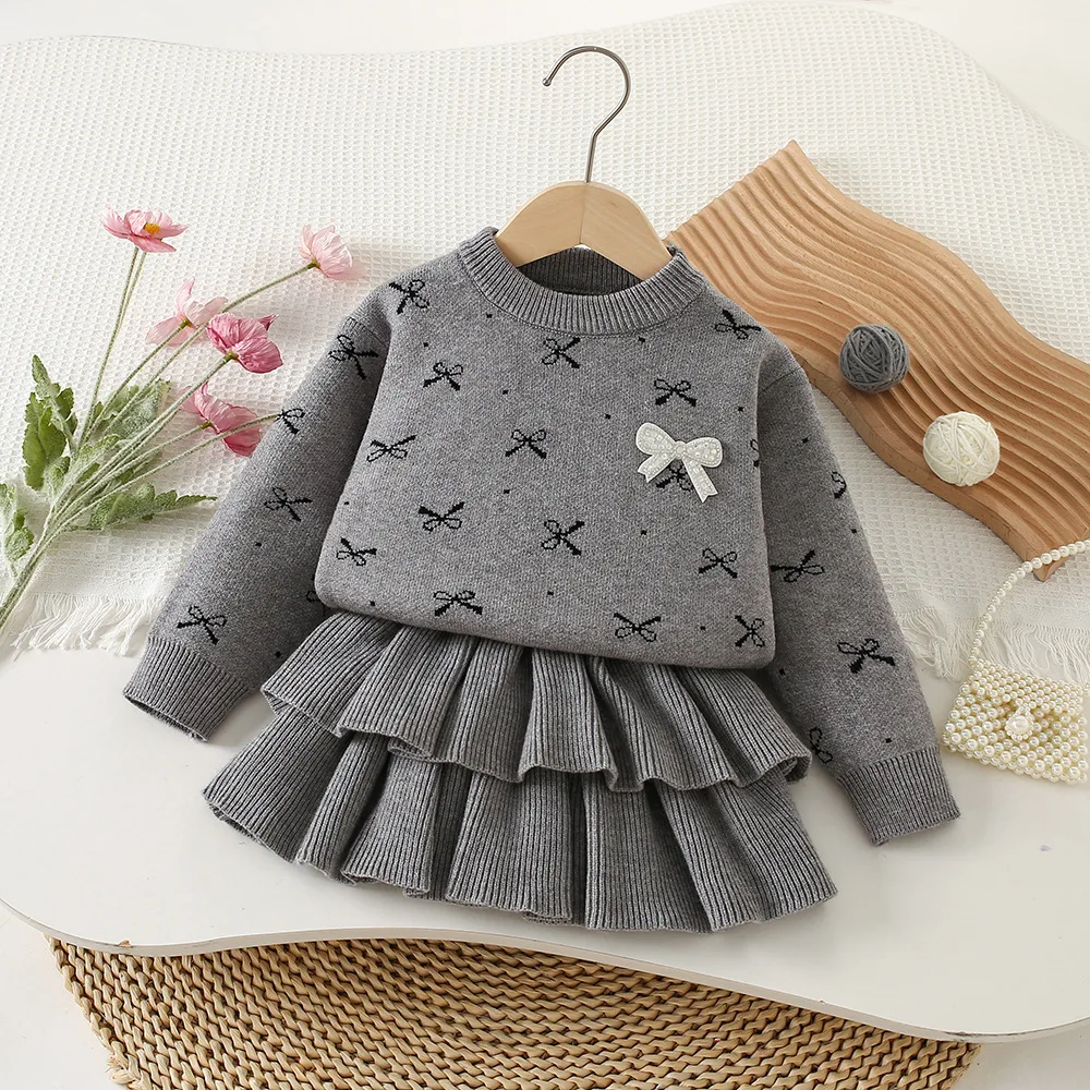 

Осень-зима 2022, новый комплект детской одежды, свитера с длинными рукавами и плиссированной юбкой с бантом, вязаный костюм из 2 предметов для девочек