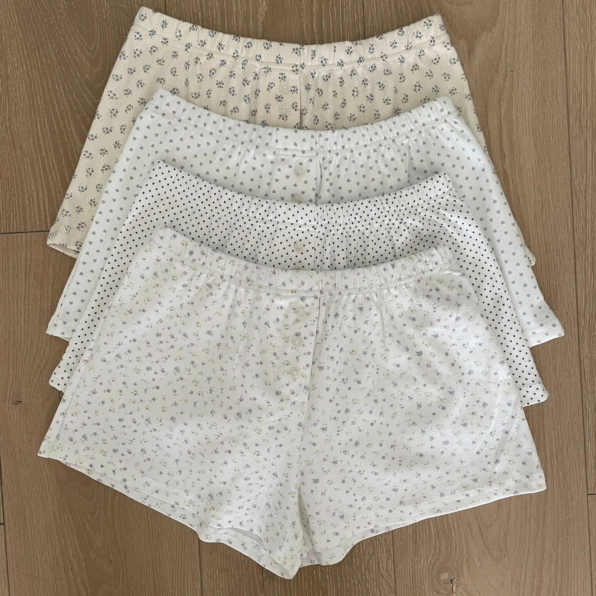 Pantalones cortos con estampado Floral blanco con ojales para mujer, novedad de verano, pantalones cortos de algodón con cintura elástica y tres botones, pantalones cortos cómodos informales para el hogar