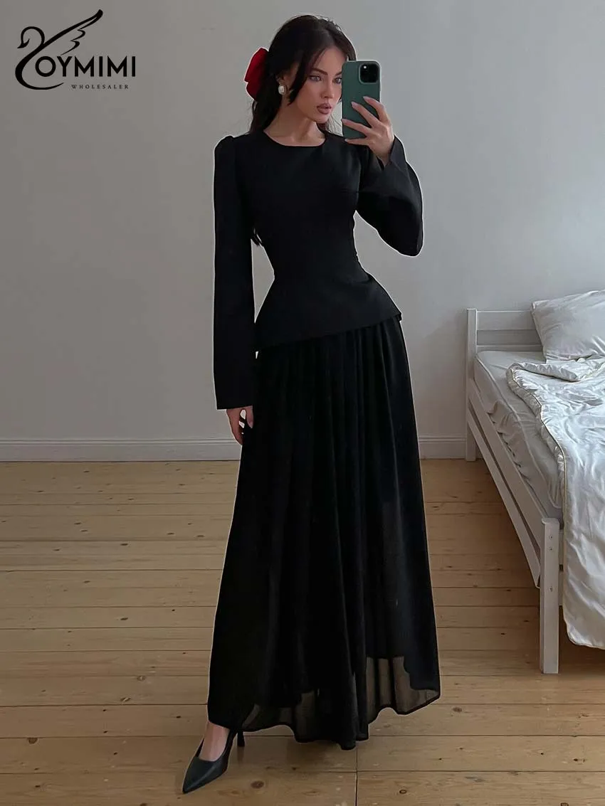 

Женский премиальный черный облегающий комплект Oymimi из 2 предметов: топ с длинным рукавом и струящаяся макси-юбка с завышенной талией. Элегантный повседневный наряд. Коллекция Весна 2026.