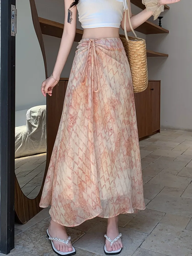 

Лето 2025 г., элегантная свободная женская стильная юбка нестандартной формы из шифона с принтом и шнурком для отпуска, стильная юбка с принтом