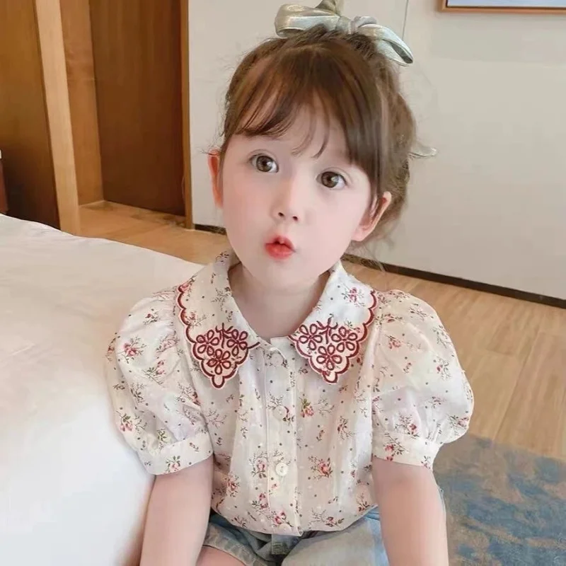 

Girls' Summer Short Sleeved Shirt 2026 New Product Floral Top Shirt Retro Summer Short Sleeved Gift for Children Aged 1-7
