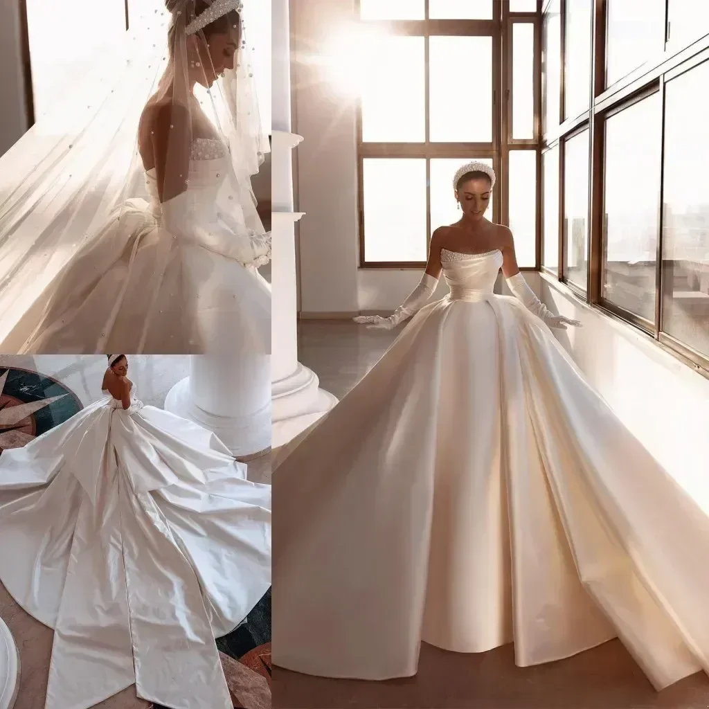 

Satin Wedding Dresses Pearls Beaded Strapless Backless Ruched Long Train Bridal Gowns With Big Bow vestidos Bride Dress