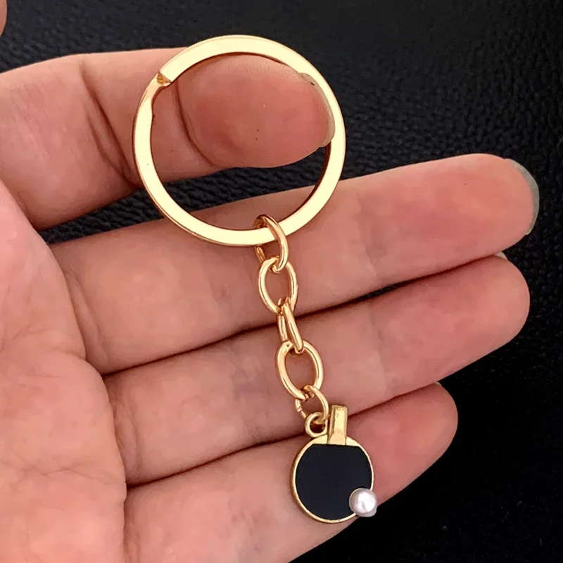 

Black Red sports table tennis tennis key chain creative table tennis bat key chain car key chain good partner gift