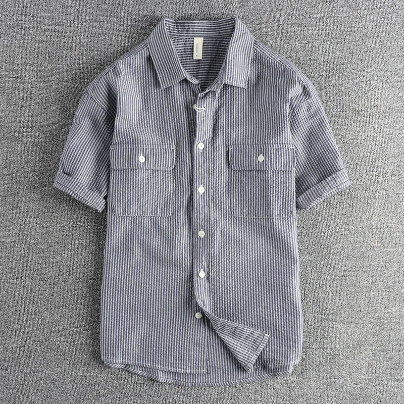 Custom woven seersucker breathable fabric vintage tooling short-sleeved shirt for men summer all fashion youth lapel T-shirt