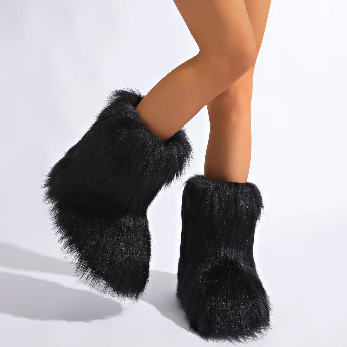 IPPEUM الكاحل المنغولية فراء الأحذية الشتاء الأسود للنساء 2025 جديد كعب مسطح حجم كبير 46 أفخم فروي الأحذية