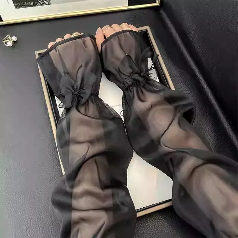 Les manches de protection solaire sont douces et mignonnes avec un nœud papillon unique offrent un look délicat, doux et haut de gamme.