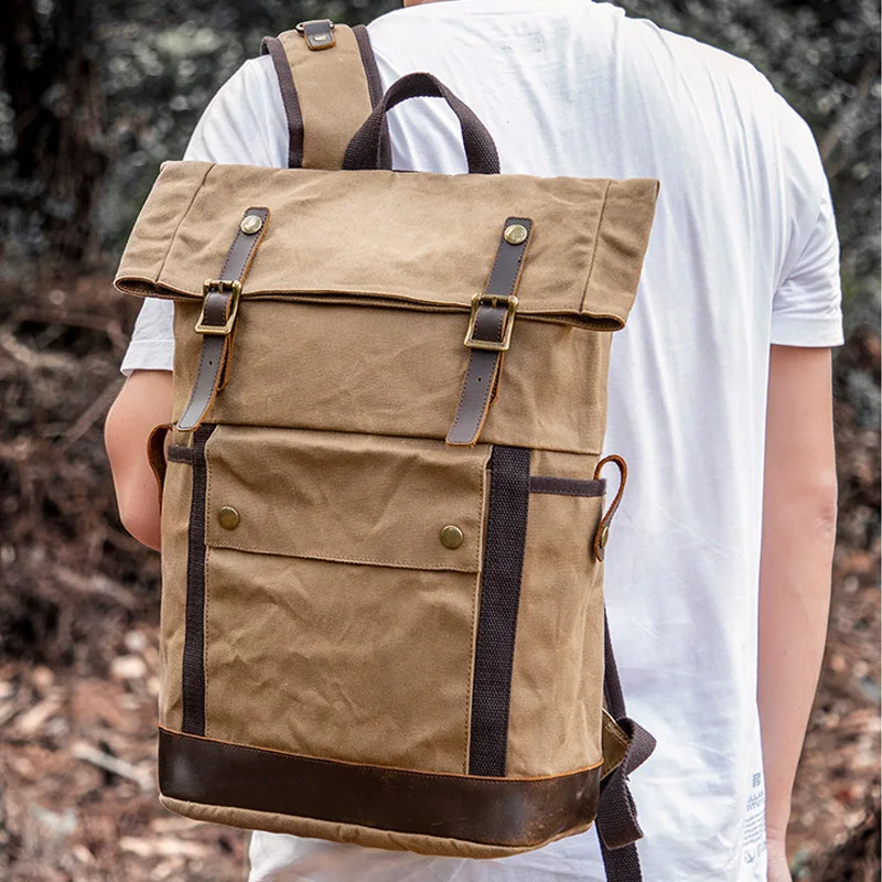 Rozkładany plecak retro o dużej pojemności dla mężczyzn, płócienny, wodoodporny plecak podróżny na zewnątrz z brązowymi skórzanymi wykończeniami i zapięciem na klamrę.