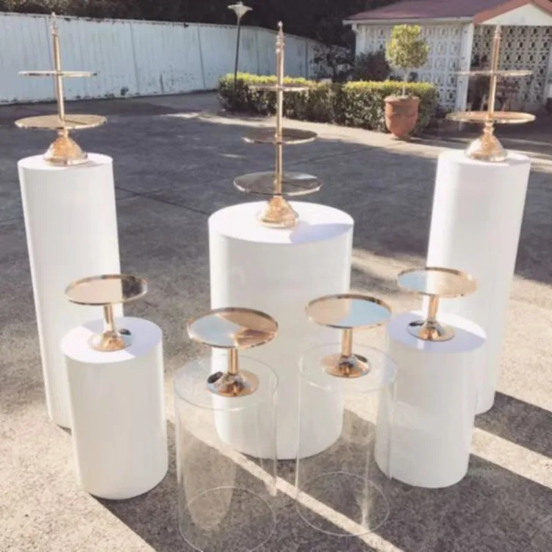 White circular column base displaying dessert cake rack, wedding pedestal table