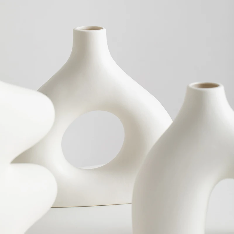 

Nordic unique white ceramic decorative modern flower vase for dried flowers and fresh flowers on the living room table, guesthou
