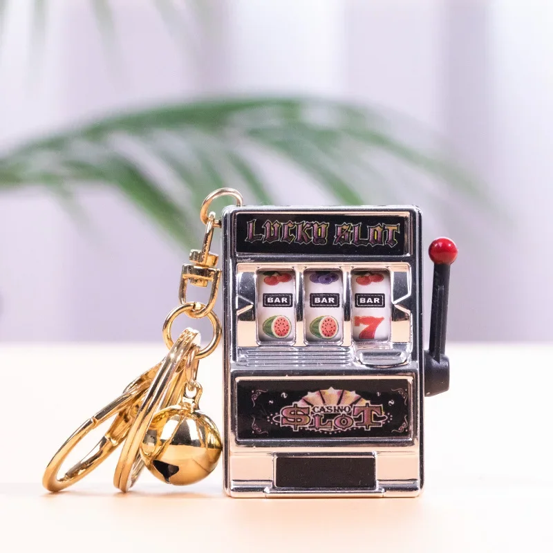 Creative Mini Turn Around Cartoon Fruit Machine Shaking Music Lottery Machine Palm Game Portable Key Chain Simulation Model Toy