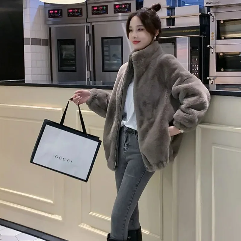 Korea Herbst und Winter Mode Jacke Damen Temperament elegantes Revers geschlitzt lose Taschen warmes Nerz Imitation Fell