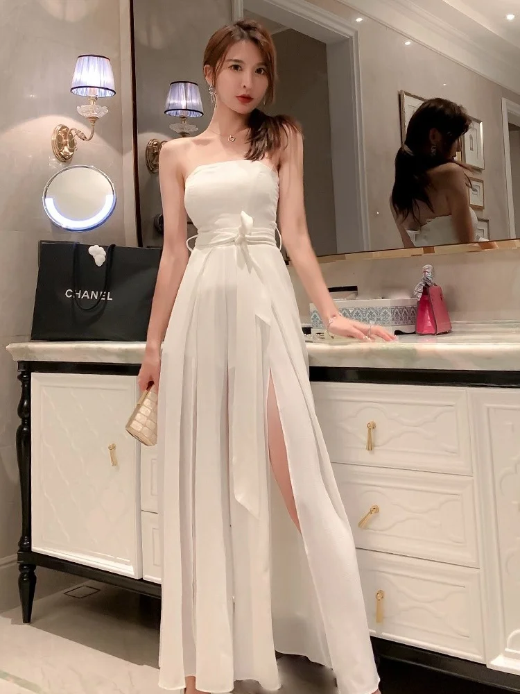 Seksowny biały kombinezon na ramiączkach 2025 Nowy Ele Lady High-End Super Fairy Spodnie z szerokimi nogawkami z rozcięciem, wysoki stan, długie spodnie, model wyszczuplający