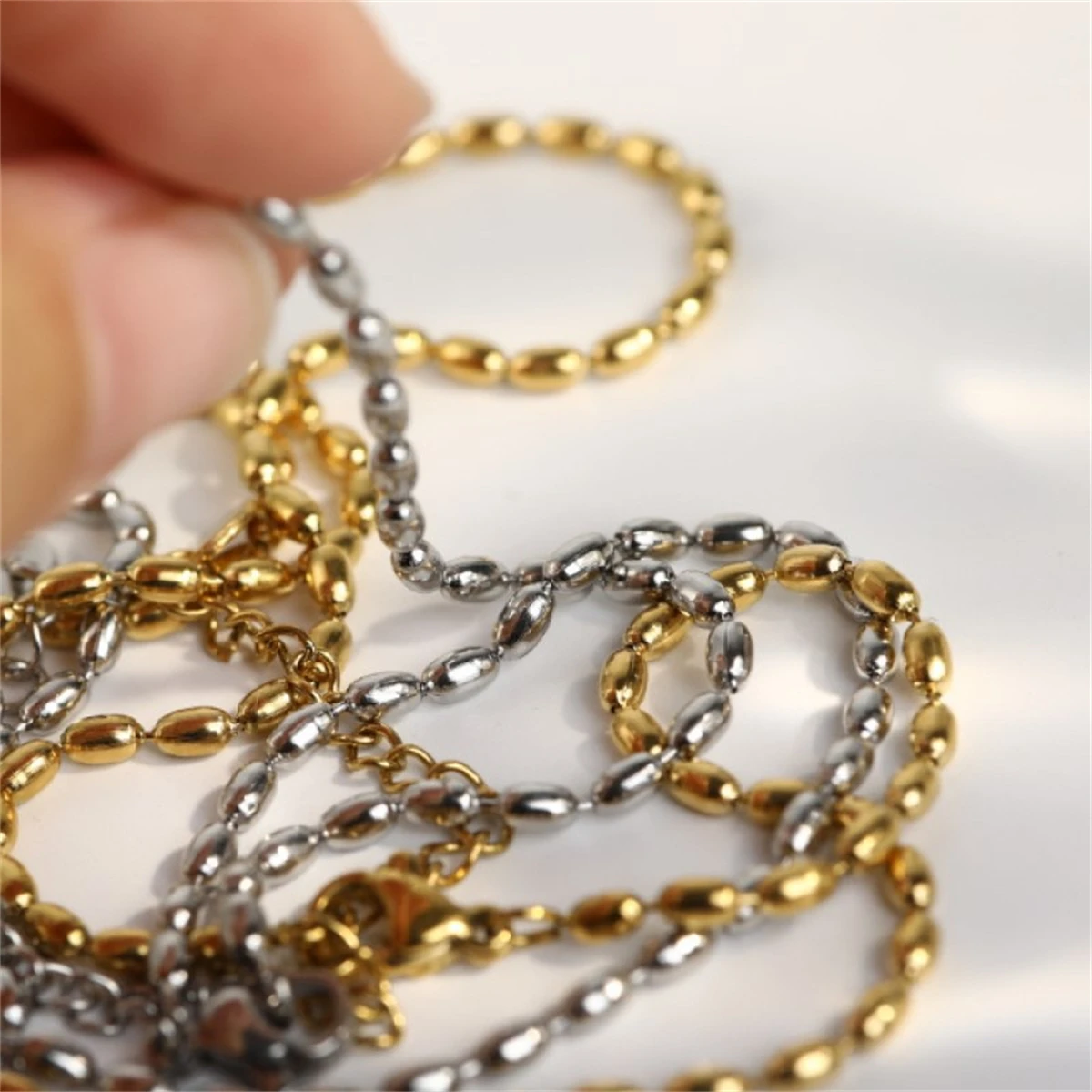 

Minimalist stainless steel metal rice bead necklace, hip-hop hip-hop plain chain plated with real gold for color preservation