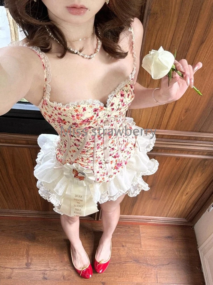フランスヴィンテージスリムプリントスリング 2 点セット女性のファッションエレガントなオフショルダーノースリーブベスト女性デザインショートスカートスーツ