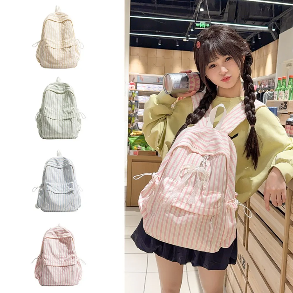 Light nylon cloth student schoolbag stripe collision color lovely bow pendant lady large capacity waterproof backpack