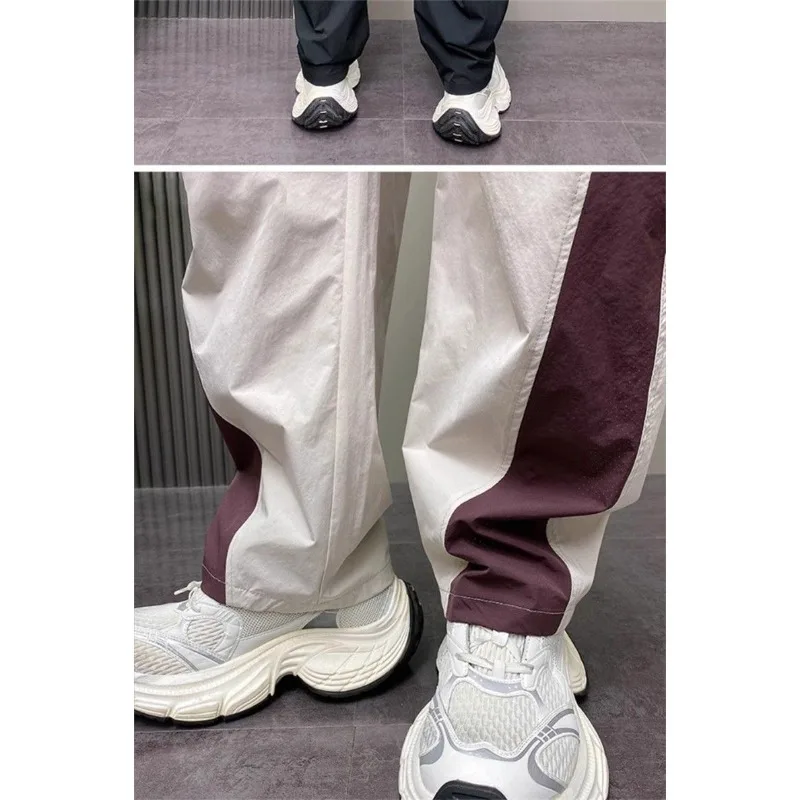 กางเกงลำลองผู้ชายทรงหลวมสไตล์อเมริกัน ขาตรง เอวยางยืดสูง มีกระเป๋า พร้อมเชือกผูกเอว สีตัดกัน