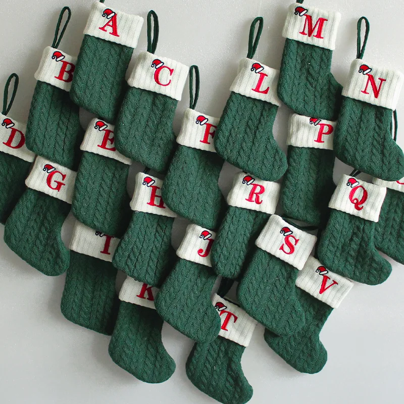 

Holiday Cheer with Green Knitted Letter Stockings as Fireplace Mantel Decor for Xmas Family Gatherings