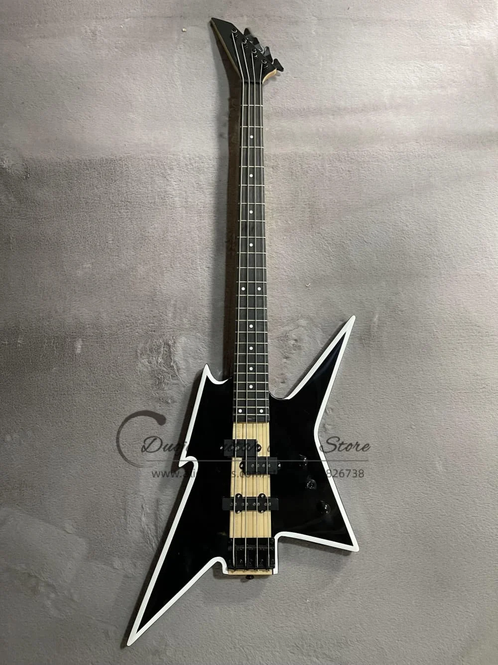 Classic 4 string black bass, with white edges, fixed bridge, maple neck through solid wood body, 3 pickups, customizable color