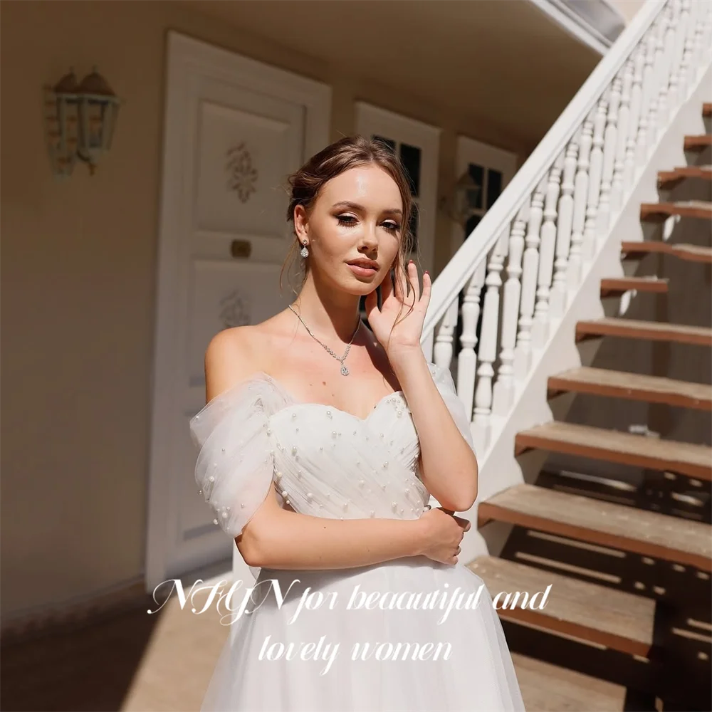 ชุดราตรีสีขาว NFYN แบบเปิดไหล่ ความยาวระดับชา พร้อมผ้าทูลล์คลุมและประดับลูกปัด สำหรับงานแต่งงาน สามารถสั่งตัดได้