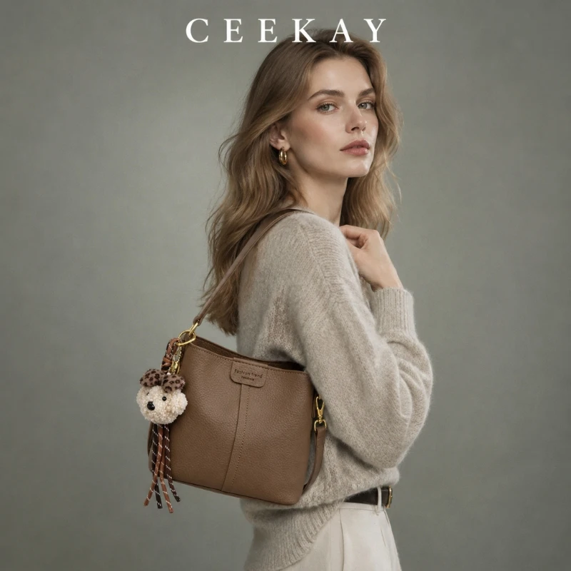 CEEKAY Pebbled Leather Bucket Bag Top Handle Adjustable Crossbody Strap Puppy Charm Tassel Chic Daily Wear Elegant for Women
