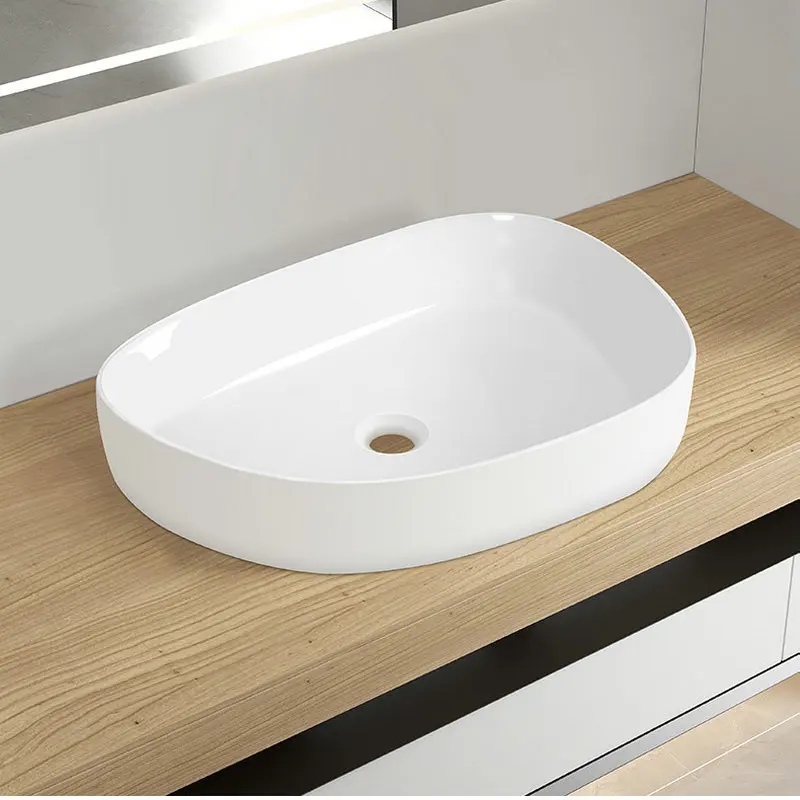 

Creative irregular white ceramic countertop basin, Nordic integrated washbasin, suitable for home bathrooms and hotels GN629YH