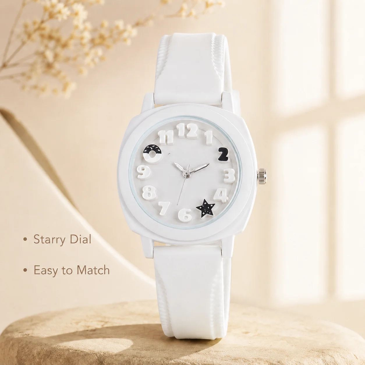 3D numeral dial analog watch with moon and star design, equipped with a soft silicone strap that is lightweight and comfortable.