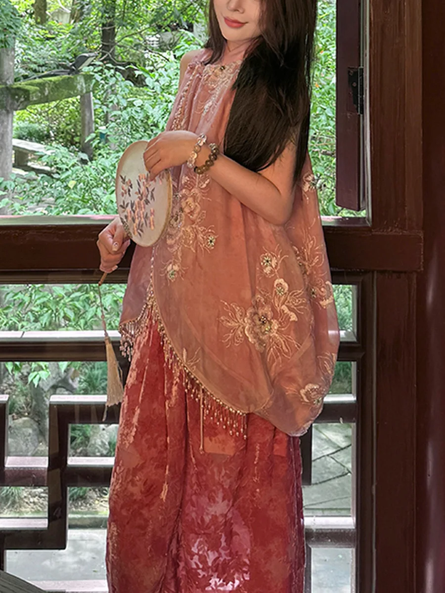 

Manjusaka Two-Piece Set. Where contemporary chic meets Eastern poetry. Adorn yourself in artistry with sequin and velvet details