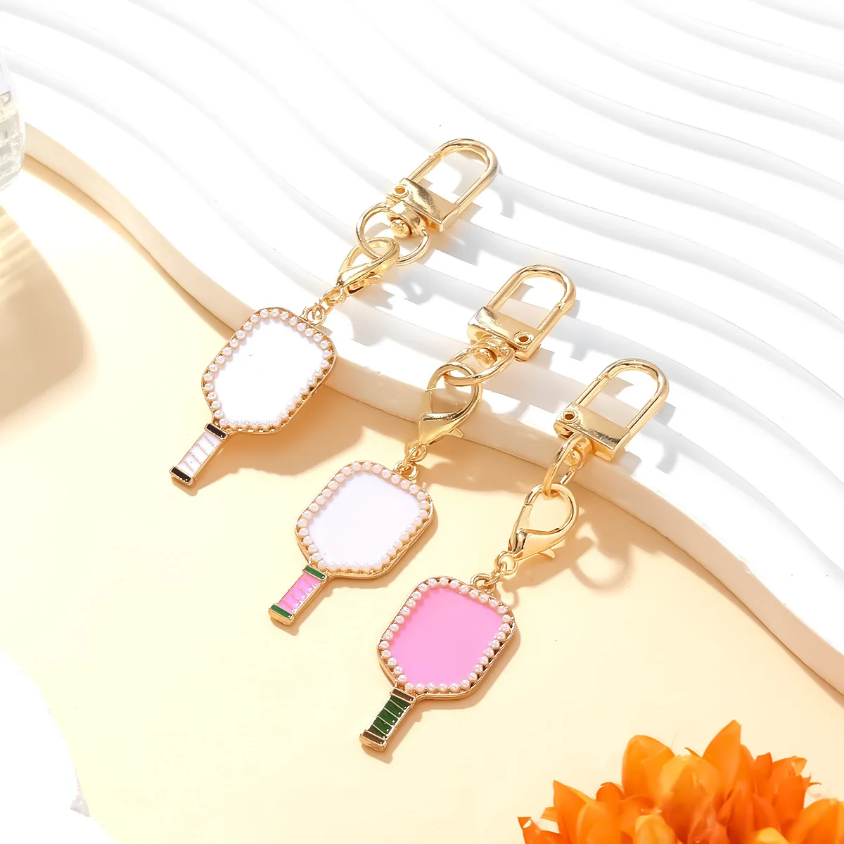 

Cute oil-dripping tennis racket pendant keychain creative enamel pearl racket pendant