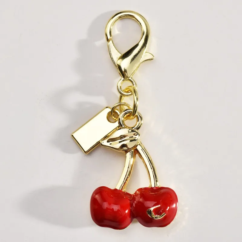 พวงกุญแจรถเชอร์รี่เรซิ่นคริสตัลที่ทันสมัยและประณีตสําหรับสุภาพสตรี, จี้กระเป๋าอุปกรณ์เสริมพวงกุญแจเชอร์รี่