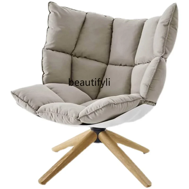 

New Light Luxury Danish designer Nordic leather single sofa chair rice husk muscle chair to discuss fabric art