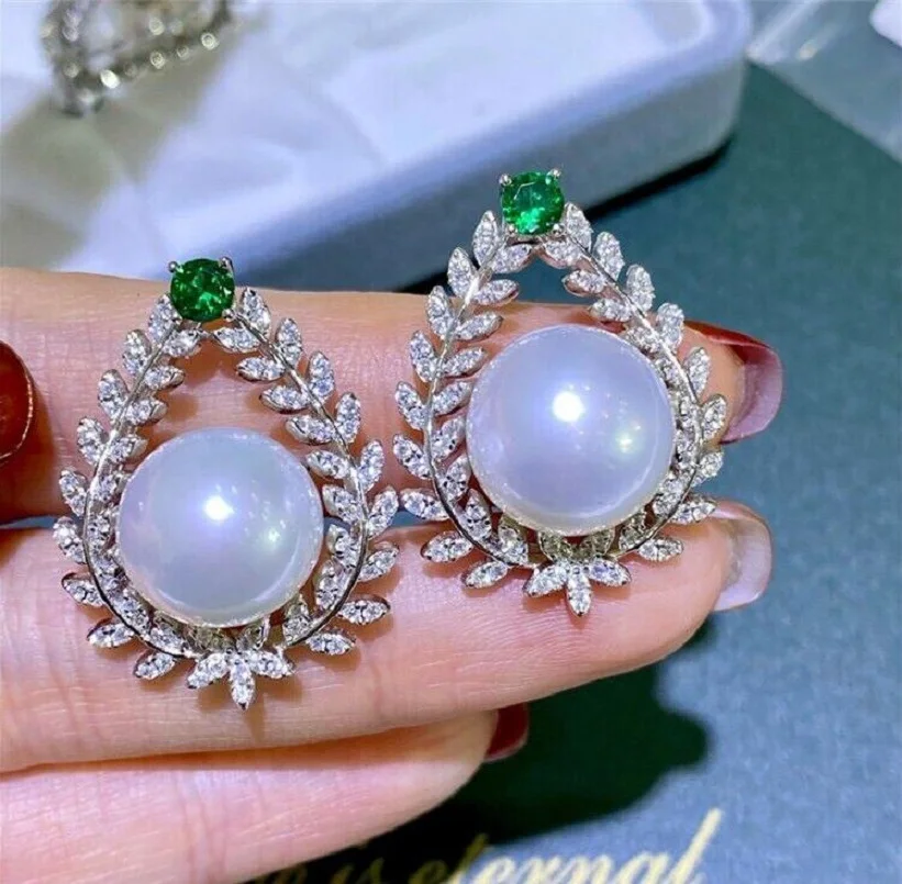 

Large quantity of Aaa 12-13mm natural South China Sea white pearl earrings 925s