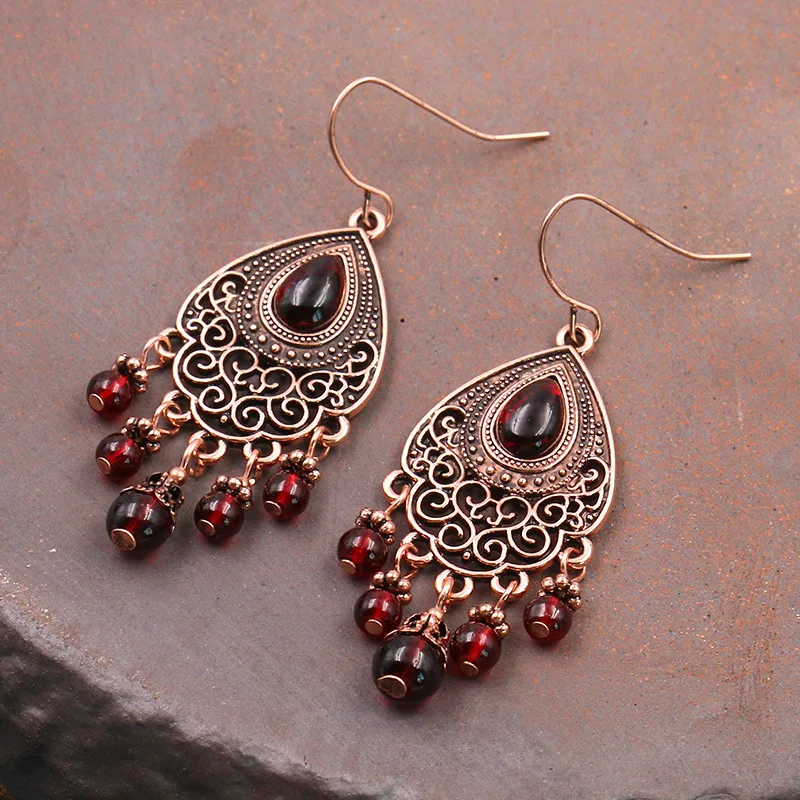European and American new retro red garnet earrings, women's geometric transfer earrings, ear jewelry, round face and thin