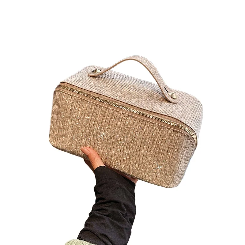 New Portable Makeup Bag with Large Capacity Zipper Partition and Multi functional Texture PU Handheld Toilet Bag for Women