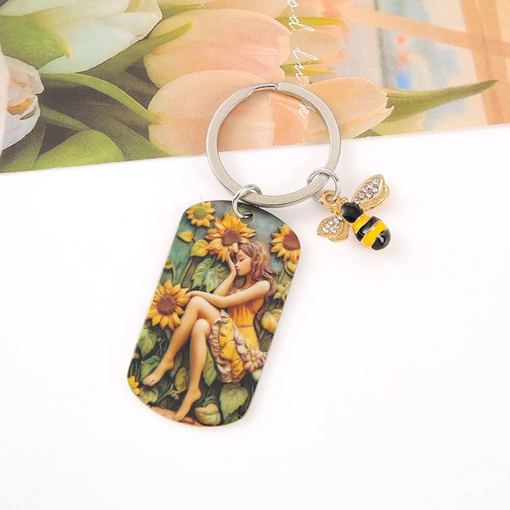 Sunflower Girl Stainless Steel Keychain Born in The Sun Metal Bag Decorations Oil Painting Girl Engraved Bag Pendant