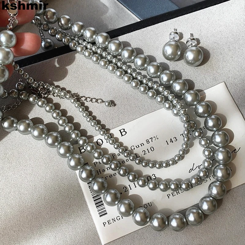 2024 New Fashion Women\'s Grey Round Glass Pearl Sweater Chain Necklace Beaded Clavicle Necklace Wholesale