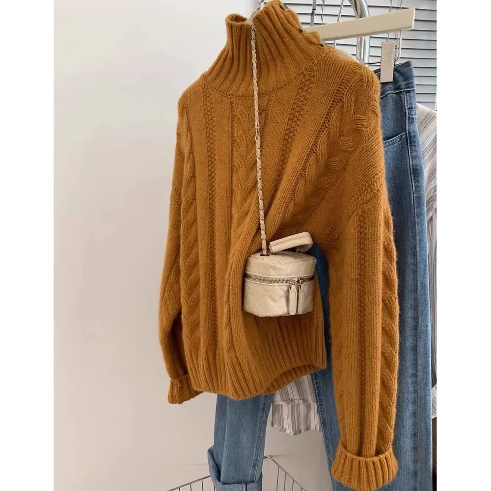 

Вязаный кашемировый свитер с высоким воротником для женщин осенью и зимой. Утолщенный и свободный свитер с высококачественной шерстяной основой.