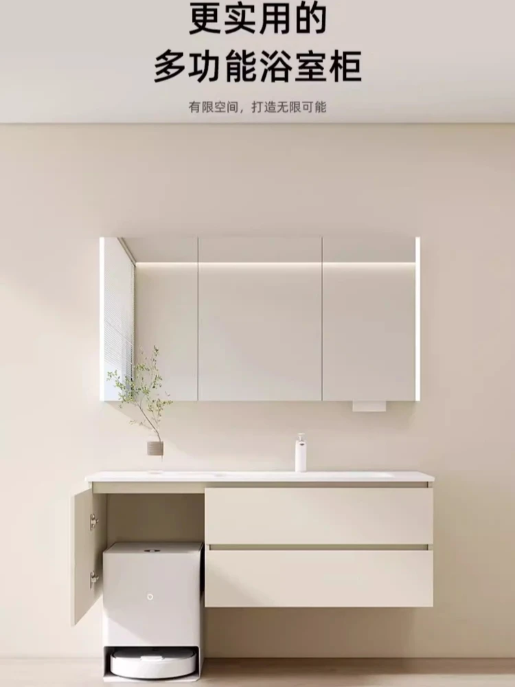 

Кремовый стол из массива дерева с интегрированной подставкой для робота-пылесоса и раковиной из гнутого камня, подходит для использования в качестве столика для уборки.