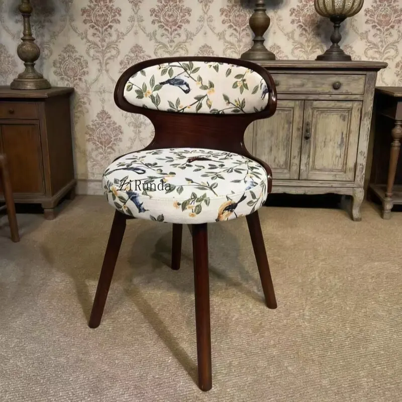 Solid wood French minimalist modern dining chair with rotating backrest, beech legs, fabric interior