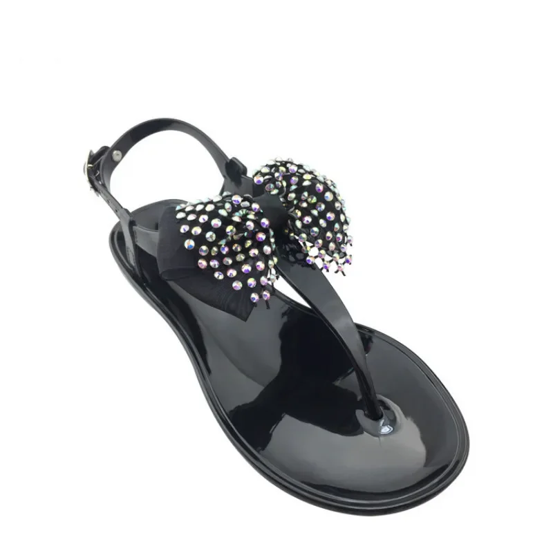 Sandali piatti da donna in gelatina sandali da spiaggia estivi da donna suola trasparente strass Bling Bow sandali antiscivolo morbidi Comfort