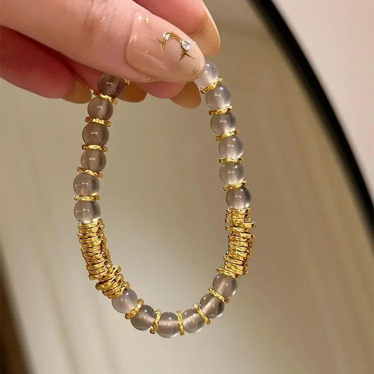 

Cool feeling gray coiled bracelet temperament ancient method sand gold this year good luck beads hammer beads