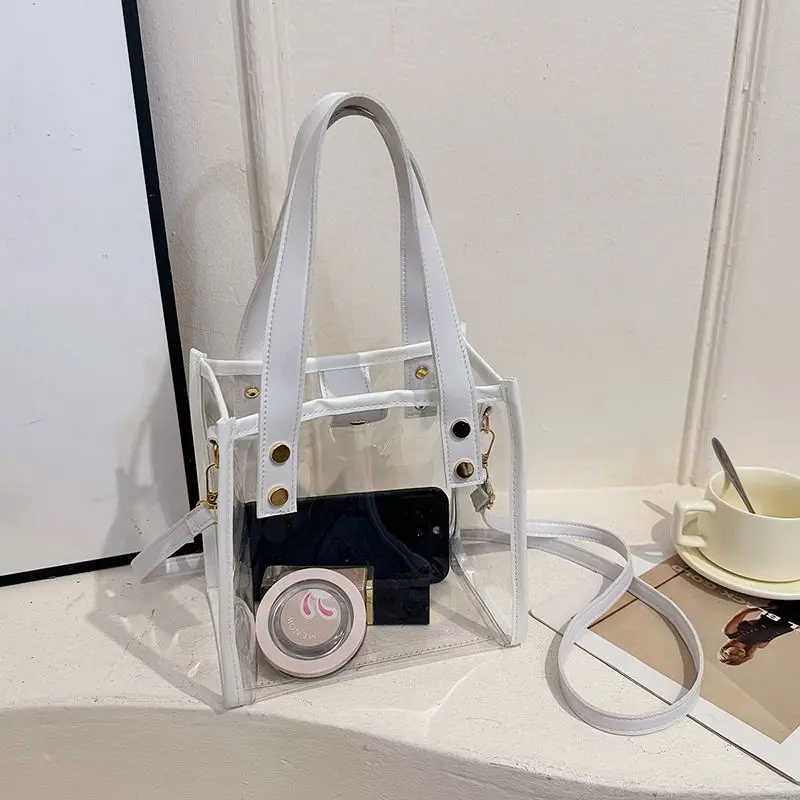 กระเป๋าเยลลี่ใส PVC ยอดนิยมสำหรับฤดูร้อน ดีไซน์ต่อผ้ากันน้ำ กระเป๋าถือผู้หญิงสุดเก๋