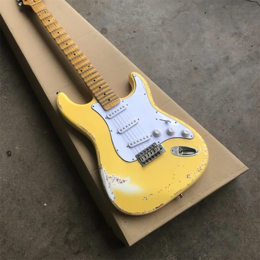 

New groove electric guitar, cream yellow, relic production, brass string pillow, real photos, free shipping